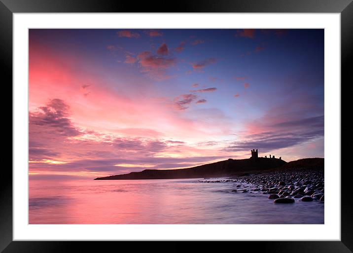 Dunstanburgh castle Sunrise Framed Mounted Print by Gail Johnson