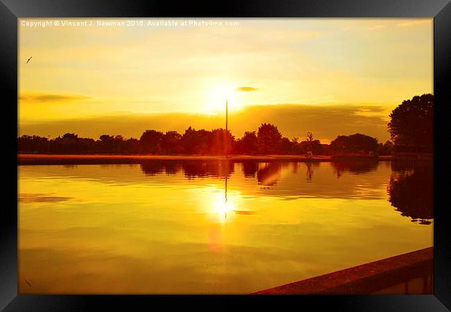  Sun Going Down Over Eaton Park Lake Framed Print by Vincent J. Newman
