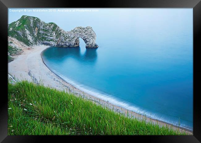 Durdle Door in the evening Framed Print by Ian Middleton