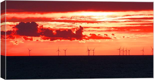 Red sunset over Thanet wind farm on a carm summer  Canvas Print by Alan Glicksman