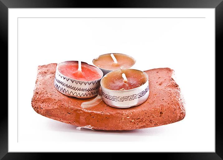 Hand-painted candles on a stone Framed Mounted Print by Gabor Pozsgai