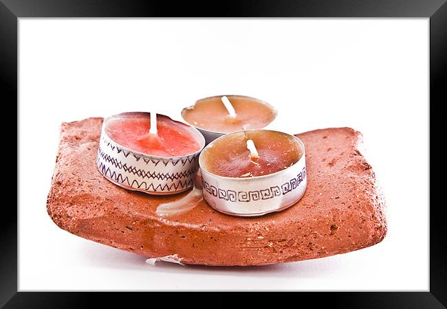 Hand-painted candles on a stone Framed Print by Gabor Pozsgai