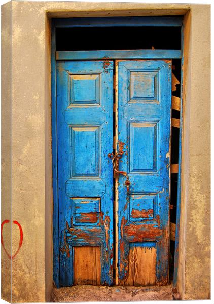 worn down blue door Canvas Print by Antony McAulay