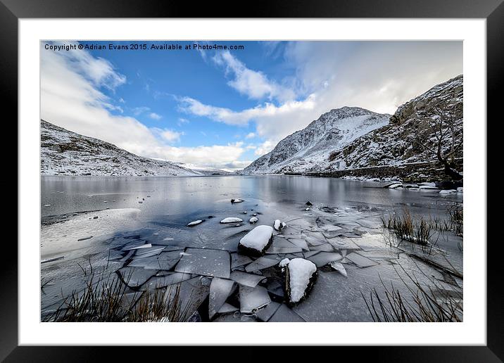 Frozen Ogwen Lake Snowdonia  Framed Mounted Print by Adrian Evans