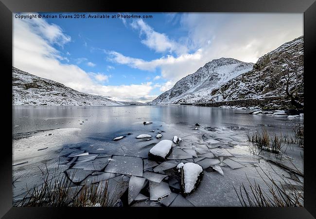 Frozen Ogwen Lake Snowdonia  Framed Print by Adrian Evans