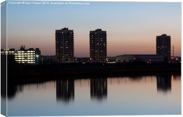 High Rise Buildings and Reflections at dusk Canvas Print by Ayo Faleye