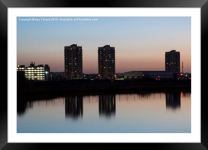 High Rise Buildings and Reflections at dusk Framed Mounted Print by Ayo Faleye