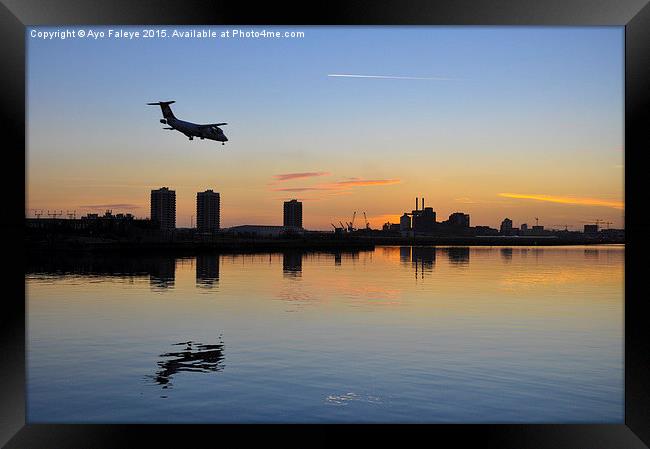  Arriving Plane at Sunset Framed Print by Ayo Faleye