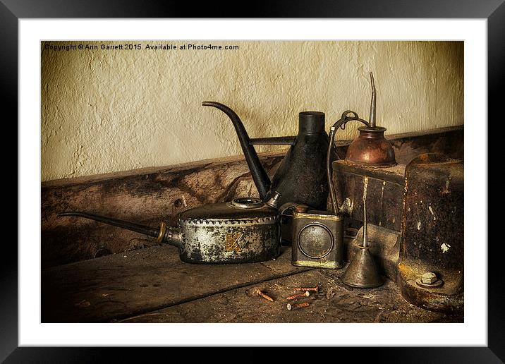 Oil Cans on the Workbench Framed Mounted Print by Ann Garrett