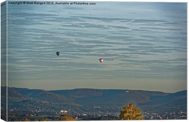  Hot air balloons over the hills Canvas Print by Mark Bangert