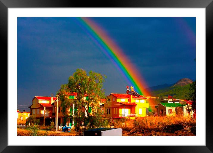 A digital painting of a rainbow over villas in the Framed Mounted Print by ken biggs