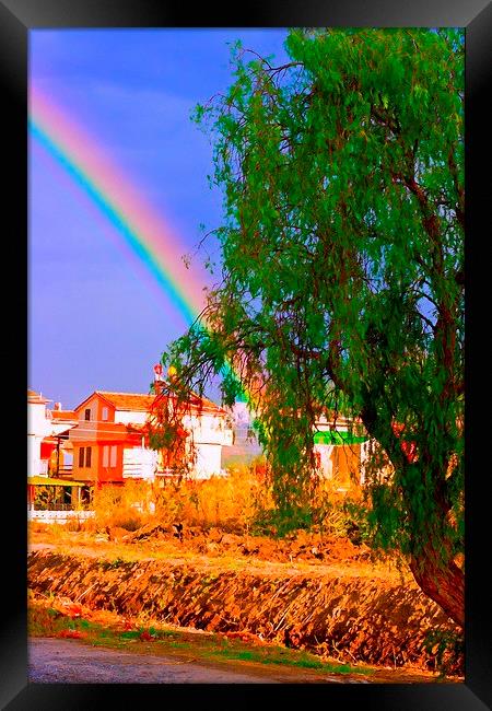 A digital painting of a rainbow over villas in the Framed Print by ken biggs