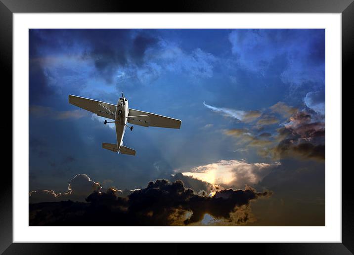 Small fixed wing plane against a stormy sky  Framed Mounted Print by ken biggs