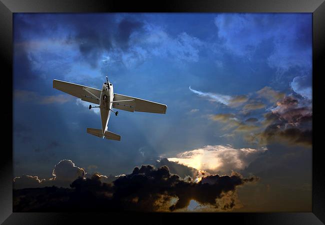 Small fixed wing plane against a stormy sky  Framed Print by ken biggs