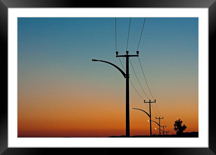 Electric power lines against a dawn sky Framed Mounted Print by ken biggs
