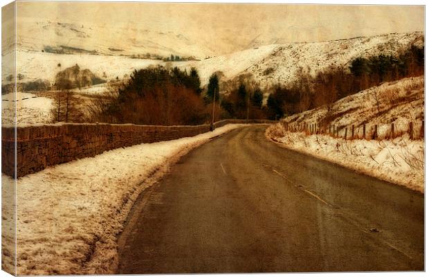 Empty road through snow covered Yorkshire moors Canvas Print by ken biggs