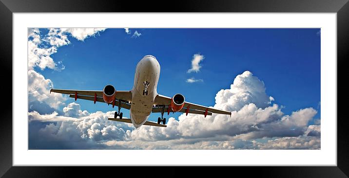Holiday jet with beautiful blue sky Framed Mounted Print by ken biggs