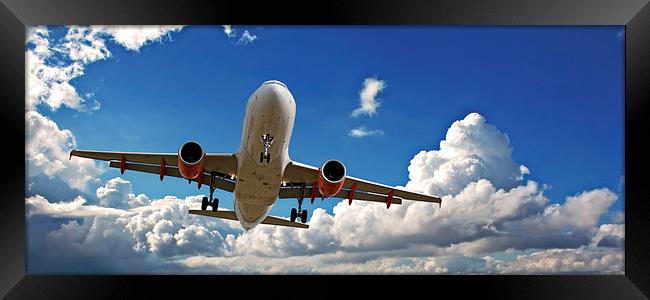 Holiday jet with beautiful blue sky Framed Print by ken biggs