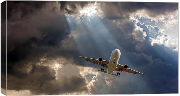 Passenger plane on final approach, against a storm Canvas Print by ken biggs
