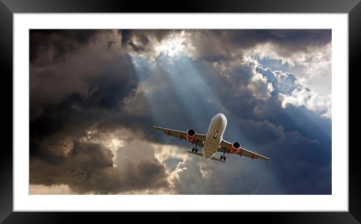 Passenger plane on final approach, against a storm Framed Mounted Print by ken biggs