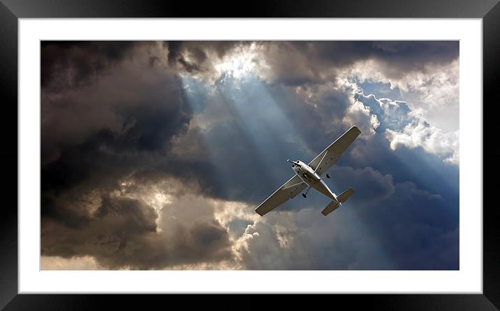 Small fixed wing plane against a stormy sky Framed Mounted Print by ken biggs
