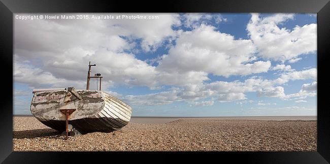  Fishing boat basking on the beach. Framed Print by Howie Marsh