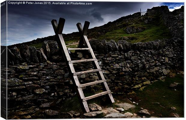 Lake District stile to the "Hole in the Wall". Canvas Print by Peter Jones
