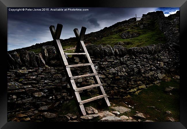  Lake District stile to the "Hole in the Wall". Framed Print by Peter Jones