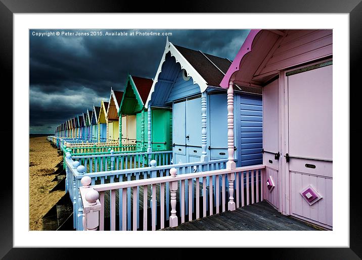  Beach Huts & Storm Clouds Framed Mounted Print by Peter Jones