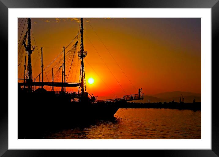 a ship in silhouette at sunset Framed Mounted Print by ken biggs