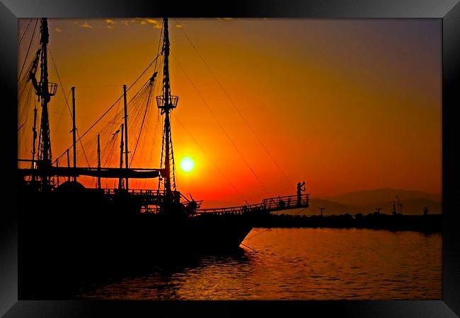 a ship in silhouette at sunset Framed Print by ken biggs