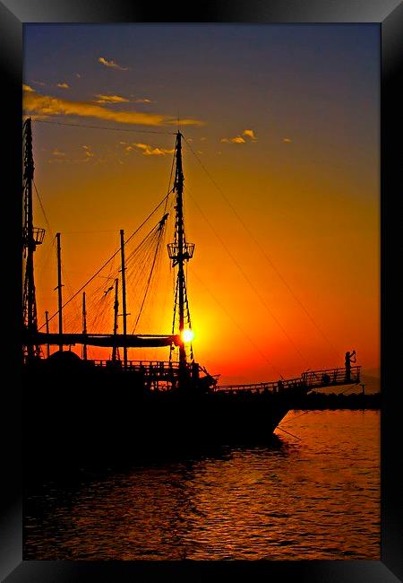 a ship in silhouette at sunset  Framed Print by ken biggs