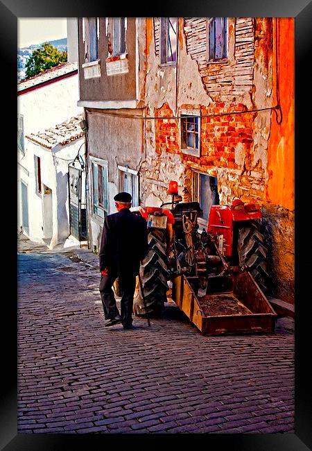 an elderly man walking past a tractor in a Turkish Framed Print by ken biggs