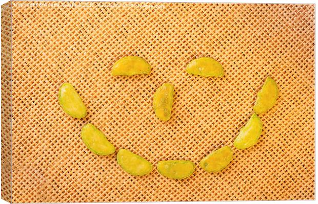 smiling face of Wasabi rice crackers Canvas Print by Arletta Cwalina