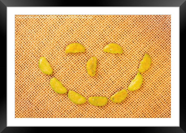 smiling face of Wasabi rice crackers Framed Mounted Print by Arletta Cwalina