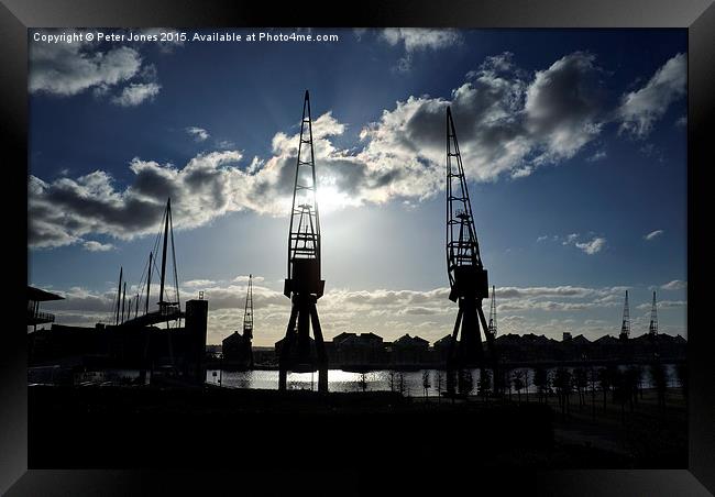 London Docklands Cranes Silhouette.  Framed Print by Peter Jones