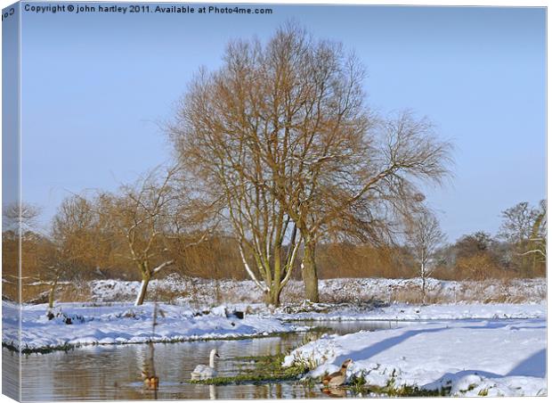 Winter snow scene by the River Wensum, Bintree Nor Canvas Print by john hartley