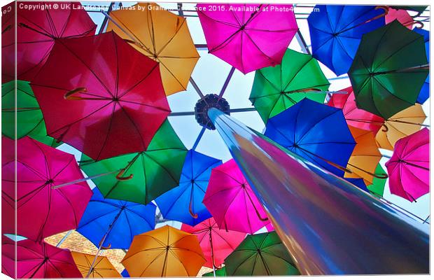 Umbrellas in Vinopolis Piazza Canvas Print by Graham Custance