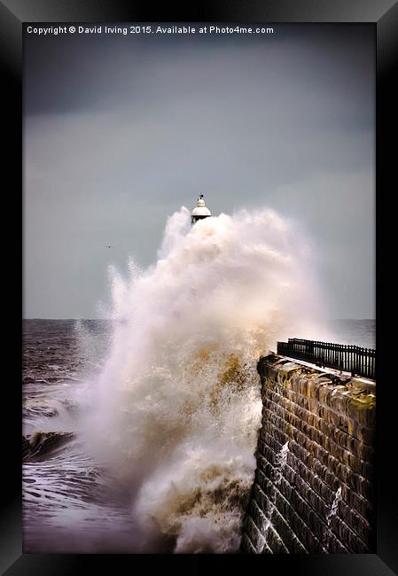 Tynemouth pier during a storm Framed Print by David Irving