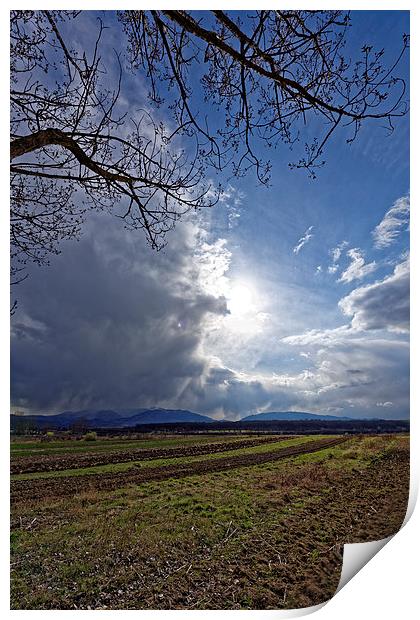 Spring plowing with angry clouds in the sky Print by Adrian Bud
