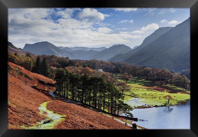  Crummock Water and surrounding hills in Autumn Framed Print by Ian Duffield