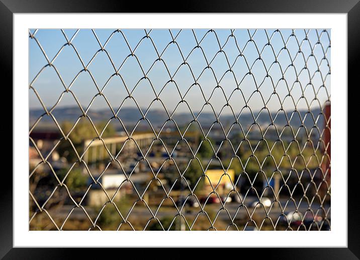 Wire fence to protect the industrial landscape Framed Mounted Print by Adrian Bud