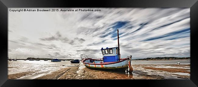 Fishing Boat at low tide Framed Print by Adrian Brockwell