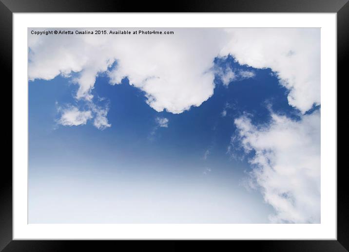 White cumulus clouds formation on blue sky  Framed Mounted Print by Arletta Cwalina