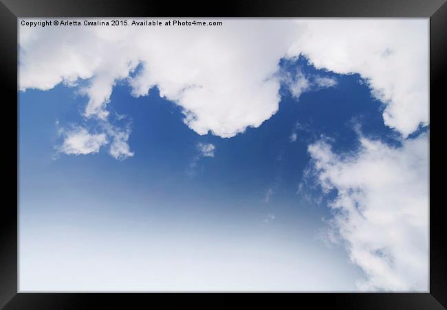 White cumulus clouds formation on blue sky  Framed Print by Arletta Cwalina