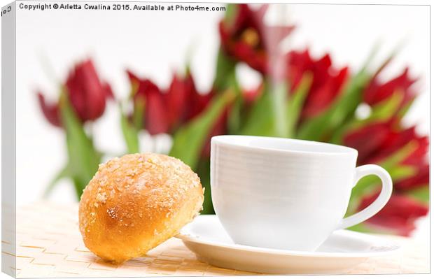 ceramic cup of hot coffee and sweet baked roll  Canvas Print by Arletta Cwalina