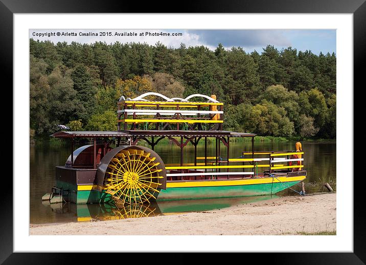 Sternwheeler moored on river strand attraction  Framed Mounted Print by Arletta Cwalina