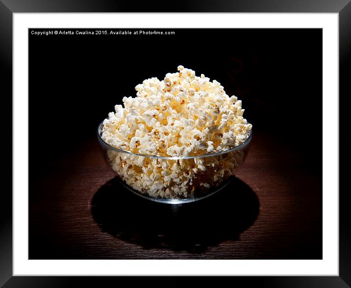popcorn in glass bowl and black shadow around  Framed Mounted Print by Arletta Cwalina