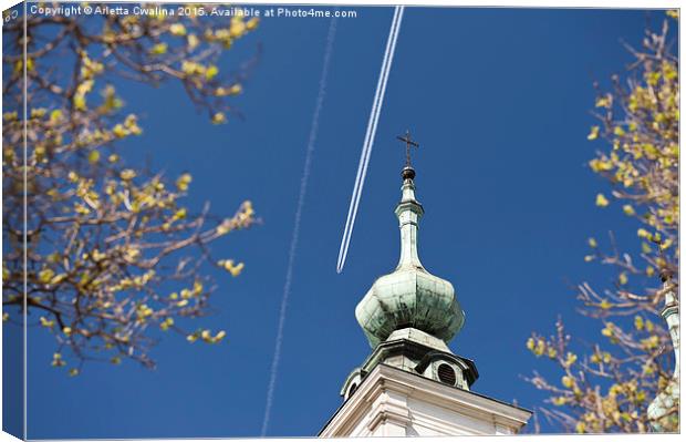 Aeroplane contrails and cross Canvas Print by Arletta Cwalina