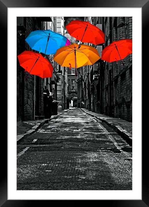  colorful umbrellas in a dark back street alley Framed Mounted Print by ken biggs